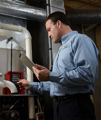 man inspecting ac system